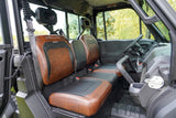 Interior of a UFORCE U10 PRO HIGHLAND utility vehicle showing brown and black bucket seats with the “Highland” logo embroidered on the headrests.