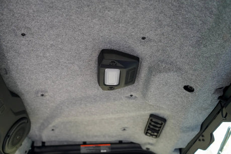 Interior ceiling of a UFORCE U10 PRO HIGHLAND showing a mounted dome light, a speaker on the left, and a vent on the right.